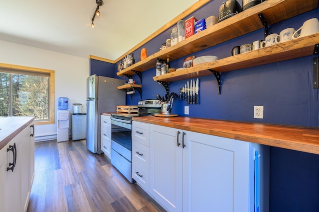 kitchen featuring white cabinetry, dark wood-style flooring, butcher block countertops, appliances with stainless steel finishes, and a baseboard radiator