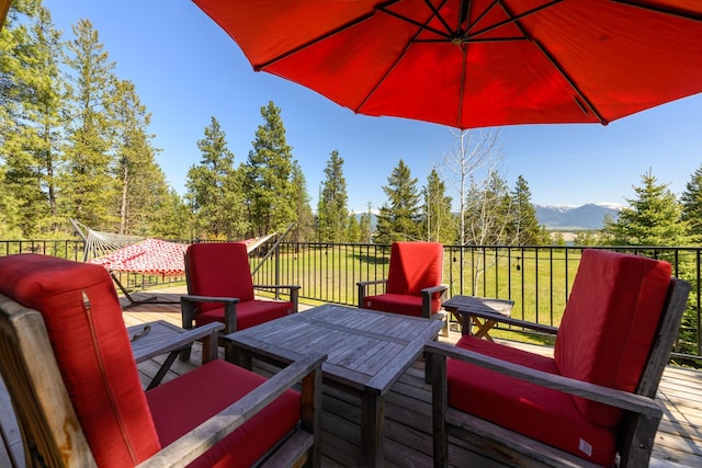 wooden deck featuring a mountain view