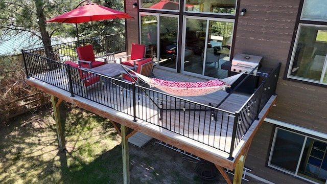 wooden deck featuring area for grilling