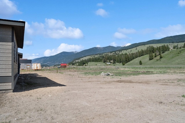 mountain view featuring a rural view