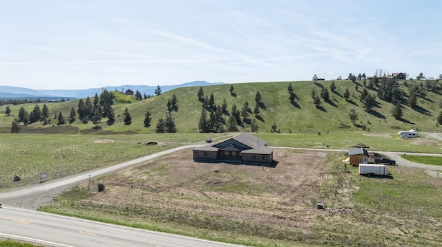 view of mountain feature with a rural view
