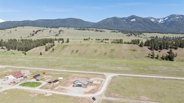 birds eye view of property with a rural view and a mountain view