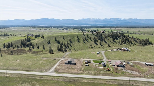 birds eye view of property with a rural view and a mountain view