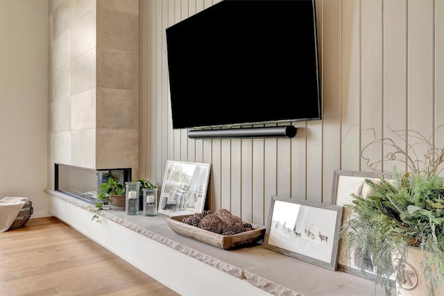 details featuring wood walls and wood finished floors