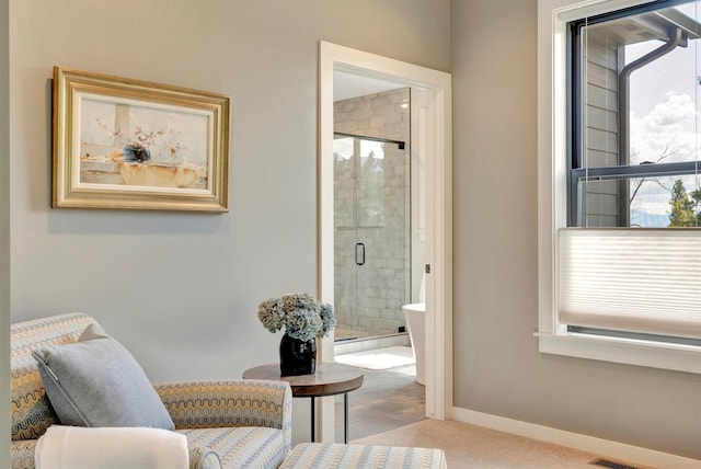 full bathroom featuring a stall shower and baseboards