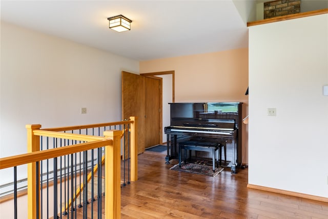 6280 Alamosa Ln, Bozeman, MT 59718 - living area with baseboards, an upstairs landing, and wood finished floors
