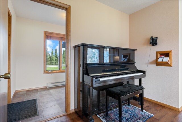 6280 Alamosa Ln, Bozeman, MT 59718 - sitting room featuring a baseboard radiator, baseboards, and wood finished floors