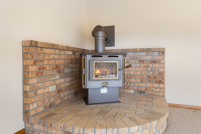 6280 Alamosa Ln, Bozeman, MT 59718 - interior details with a wood stove, carpet, and baseboards
