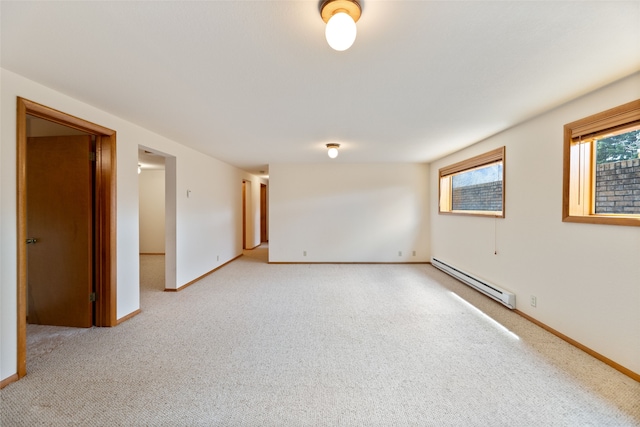 6280 Alamosa Ln, Bozeman, MT 59718 - spare room with light carpet, baseboards, and a baseboard heating unit