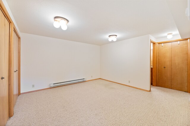 6280 Alamosa Ln, Bozeman, MT 59718 - interior space featuring a closet, light carpet, baseboards, and a baseboard heating unit
