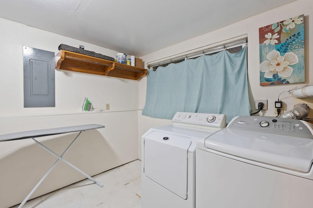 clothes washing area featuring laundry area, independent washer and dryer, and electric panel