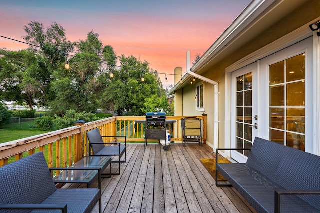 deck featuring a grill