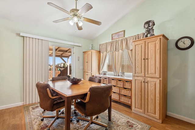 107 Cally Ln, Kalispell, MT 59901 - dining space with vaulted ceiling, a ceiling fan, and light wood-type flooring