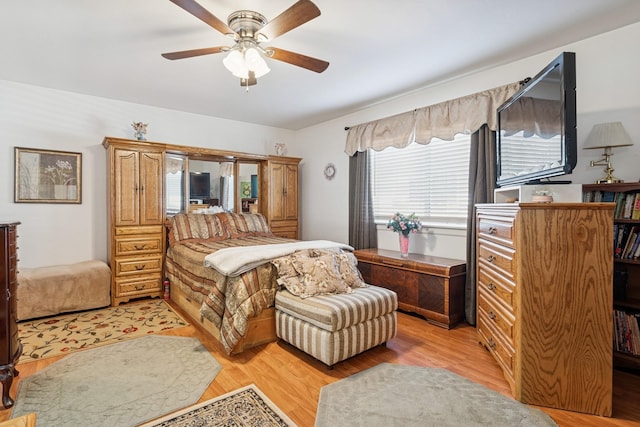 bedroom featuring light wood finished floors and ceiling fan