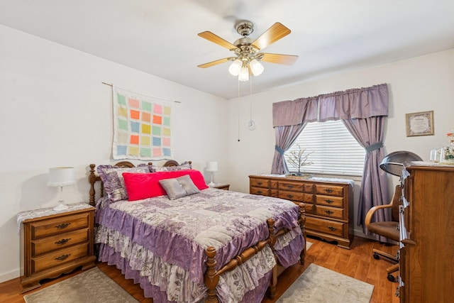 bedroom featuring a ceiling fan and light wood finished floors