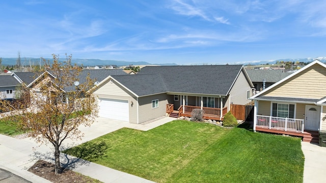 view of front facade with an attached garage, concrete driveway, a porch, and a front lawn
