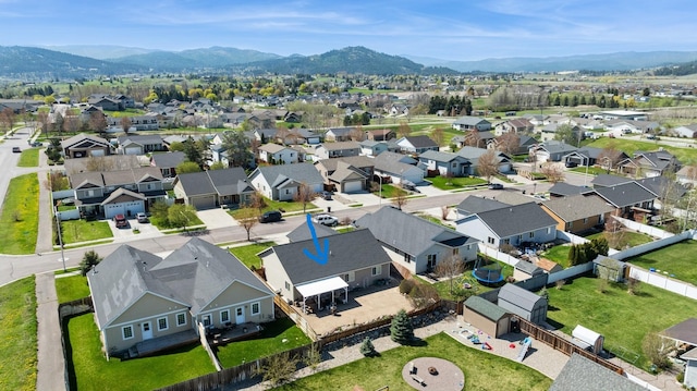 aerial view featuring a mountain view and a residential view