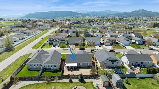 bird's eye view featuring a mountain view and a residential view