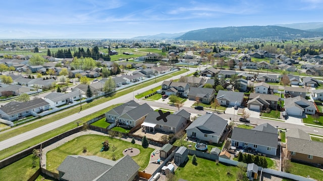 aerial view featuring a mountain view and a residential view