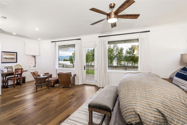 bedroom featuring multiple windows, wood finished floors, access to exterior, and recessed lighting