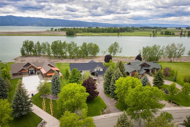 bird's eye view with a water and mountain view