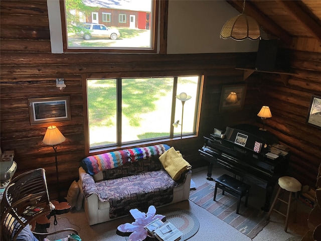 living room with rustic walls and carpet