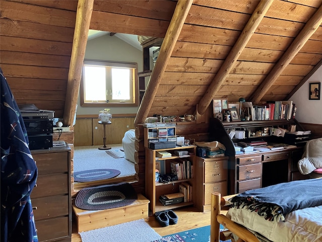 bedroom featuring wooden ceiling, wood finished floors, and lofted ceiling with beams