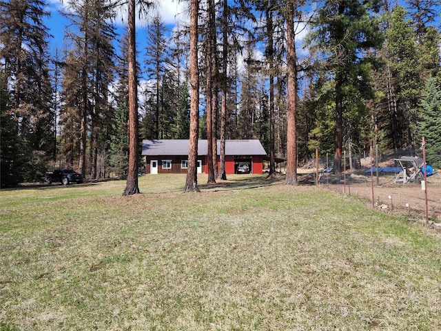 view of yard with a forest view