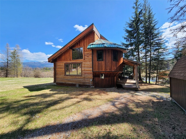 view of side of home featuring a lawn