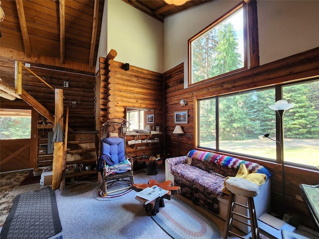 living area featuring wood ceiling, high vaulted ceiling, carpet floors, log walls, and beamed ceiling
