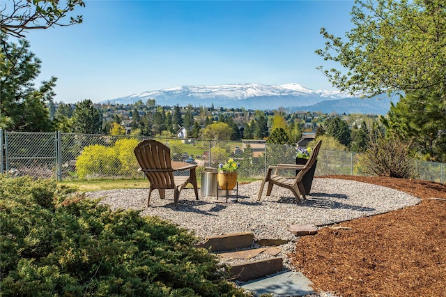 exterior space with a mountain view and fence