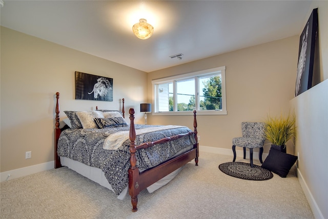 bedroom featuring light carpet, baseboards, and visible vents