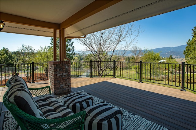 wooden deck featuring a mountain view