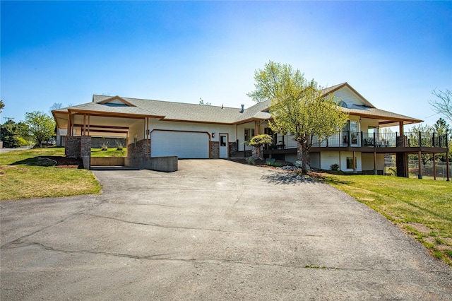 single story home featuring driveway, an attached garage, and a front yard