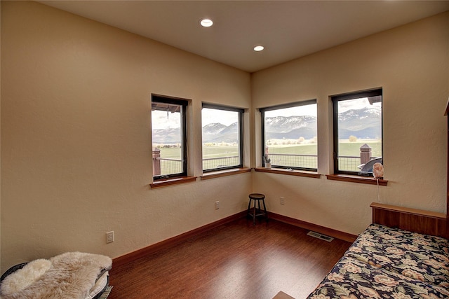 unfurnished bedroom featuring recessed lighting, baseboards, visible vents, and dark wood finished floors