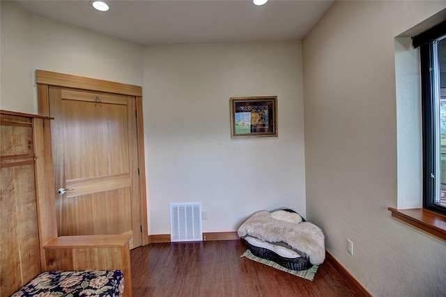 living area with visible vents, wood finished floors, baseboards, and recessed lighting