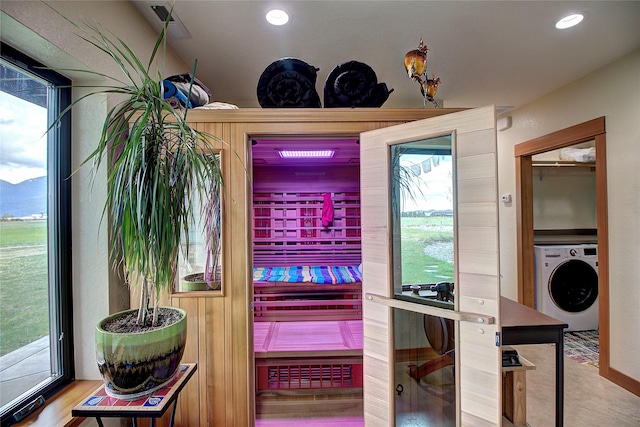 room details featuring washer / dryer and recessed lighting