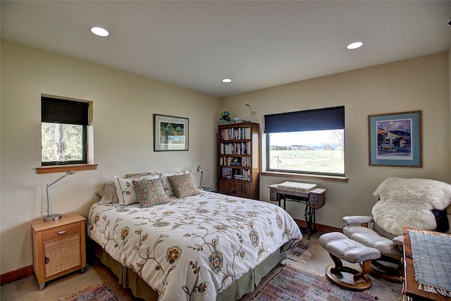 bedroom with multiple windows, baseboards, and recessed lighting