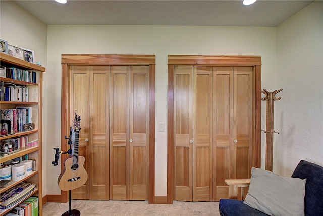 interior space with carpet flooring, baseboards, and recessed lighting