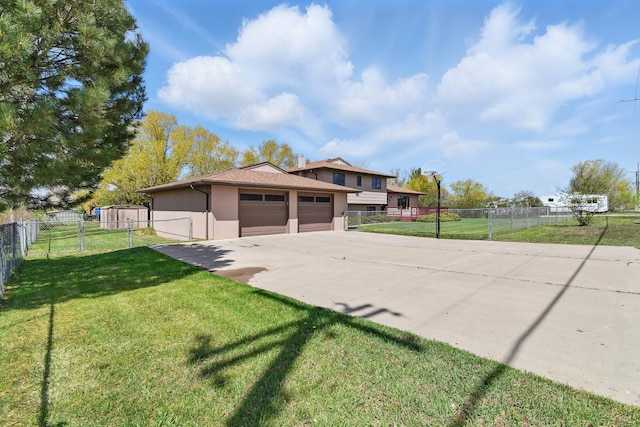 view of property exterior with a yard, an outbuilding, fence, and concrete driveway