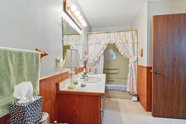 full bathroom featuring vanity, wainscoting, and a shower with shower curtain