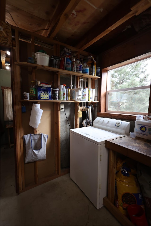 clothes washing area featuring washer / dryer and laundry area