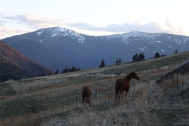 view of mountain feature with a rural view