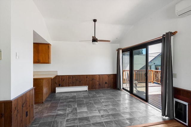 1108 9th St E, Polson, MT 59860 - unfurnished dining area with baseboard heating, a wall mounted AC, wooden walls, lofted ceiling, and wainscoting