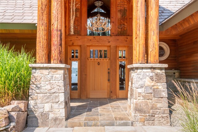 144 S Shore Pl, Seeley Lake, MT 59868 - property entrance featuring stone siding