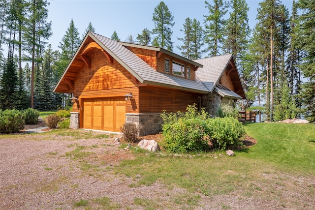144 S Shore Pl, Seeley Lake, MT 59868 - view of side of property featuring stone siding, a detached garage, a lawn, and dirt driveway