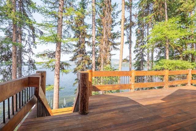 144 S Shore Pl, Seeley Lake, MT 59868 - wooden terrace with a water view