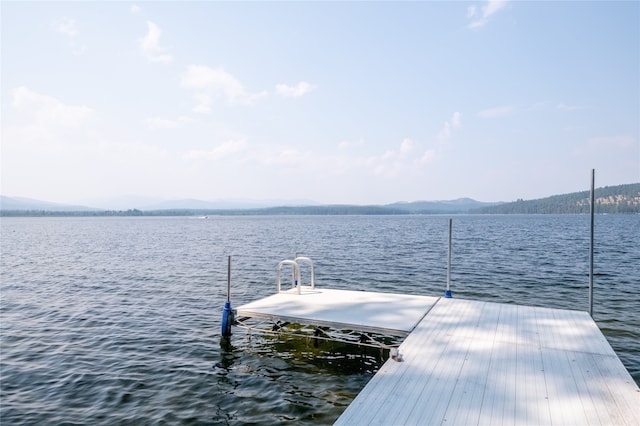 144 S Shore Pl, Seeley Lake, MT 59868 - dock featuring a water and mountain view