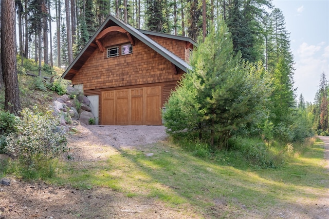 144 S Shore Pl, Seeley Lake, MT 59868 - garage featuring driveway and a garage