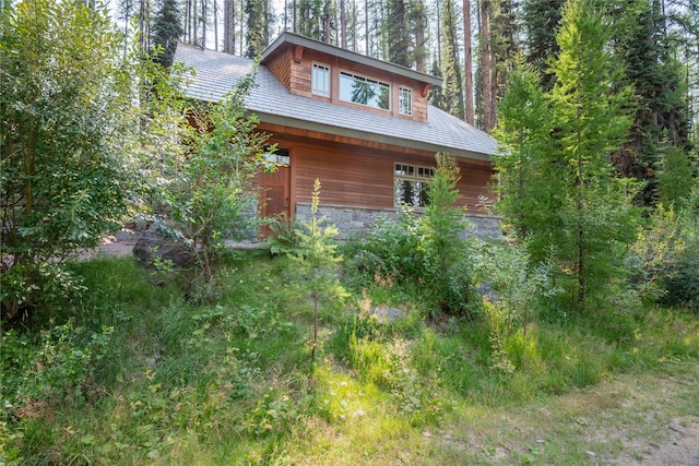144 S Shore Pl, Seeley Lake, MT 59868 - view of side of property featuring stone siding